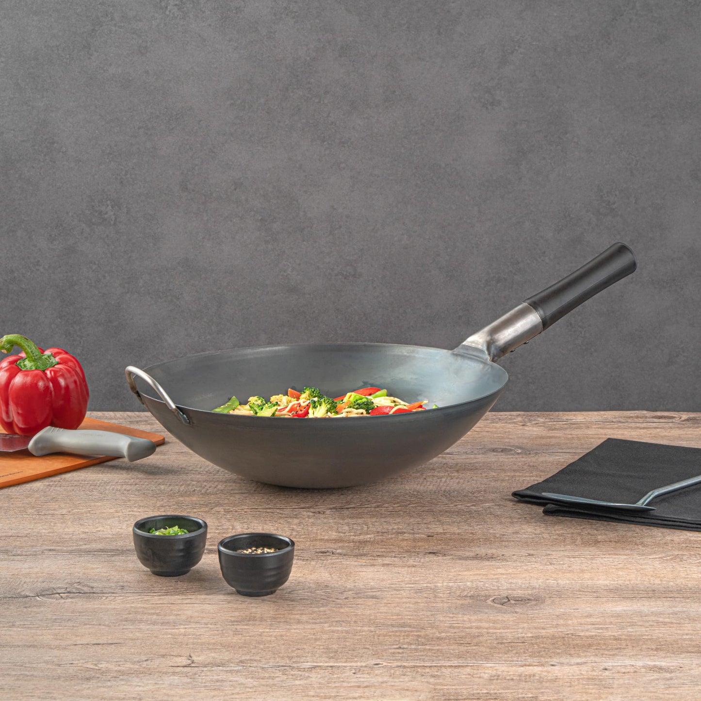 Restaurantware Carbon Steel Wok 1 Pack of 14 Inch Heavy-Duty Uniform Heat Distribution Pan Induction Compatible Round Bottom Wok Welded Handle Black For Gas Stovetops And Grills