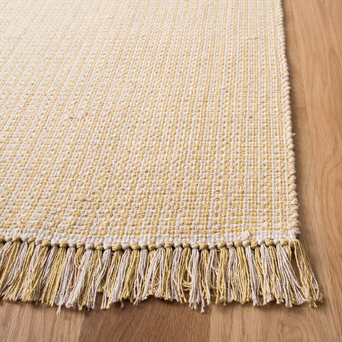 SAFAVIEH Montauk Collection Accent Rug - 4' x 6', Ivory & Yellow, Handmade Flat Weave Boho Farmhouse Cotton Tassel Fringe, Ideal for High Traffic Areas in Entryway, Living Room, Bedroom (MTK340E)
